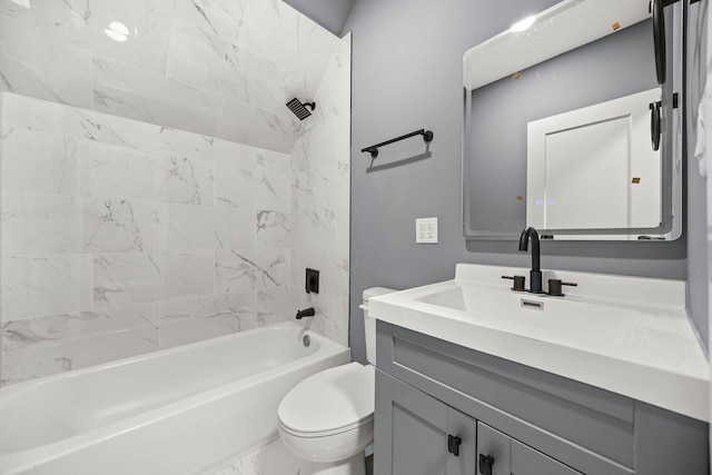 full bathroom featuring vanity, toilet, and tiled shower / bath