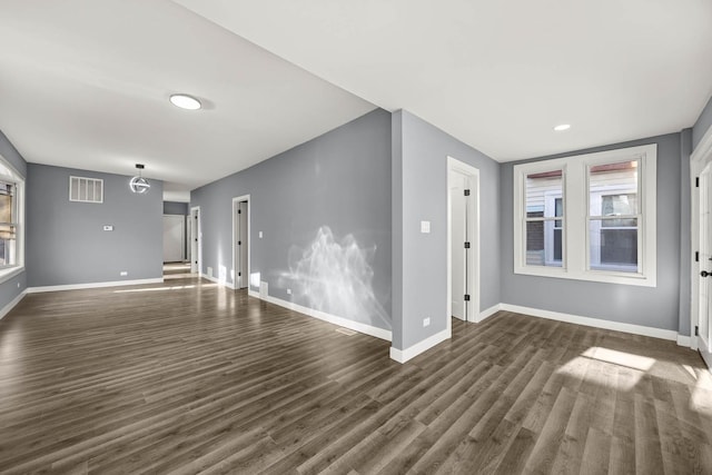 spare room featuring dark hardwood / wood-style floors