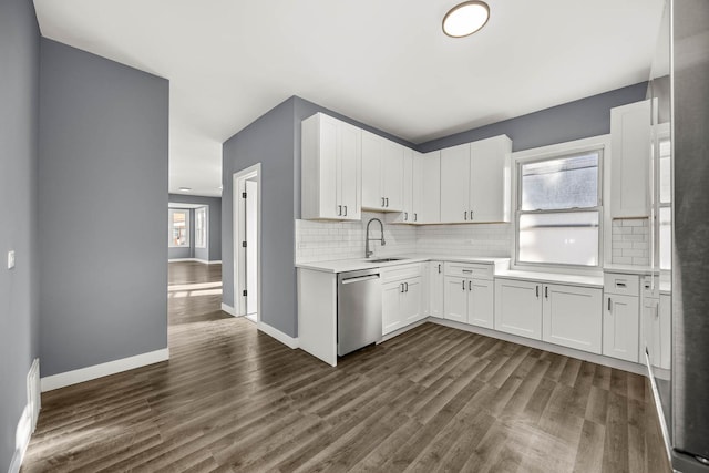 kitchen featuring dishwasher, dark hardwood / wood-style flooring, white cabinets, and sink