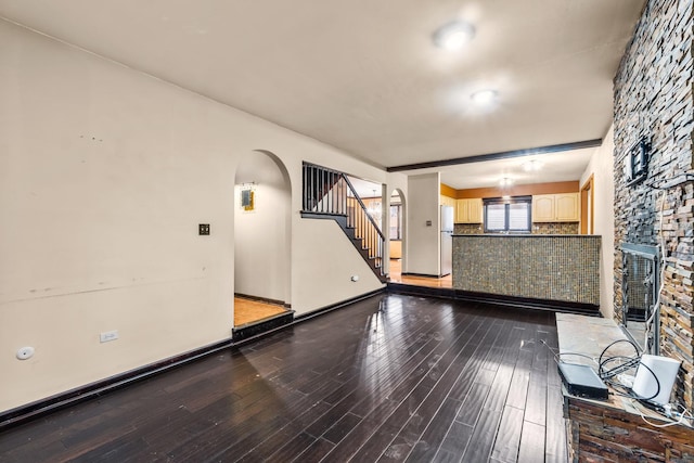 unfurnished living room with hardwood / wood-style flooring