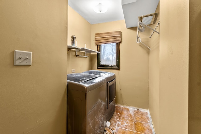 washroom featuring washer and dryer