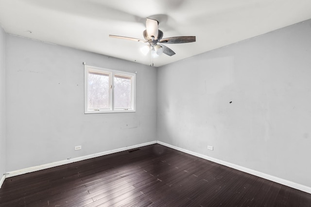 empty room with ceiling fan and wood-type flooring