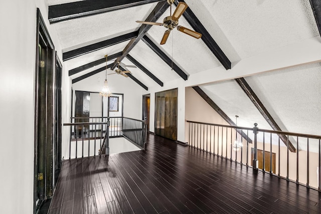 bonus room with lofted ceiling with beams, wood-type flooring, a textured ceiling, and ceiling fan with notable chandelier