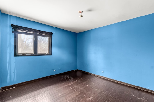 empty room featuring dark hardwood / wood-style floors