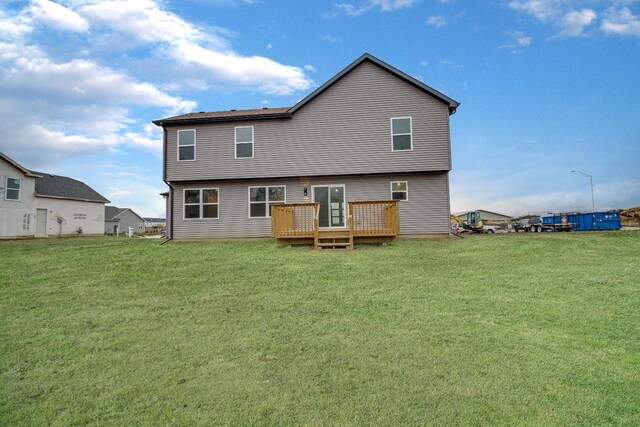 view of side of property with a yard and a garage