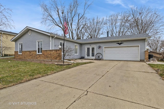 ranch-style home with french doors, a front lawn, and a garage