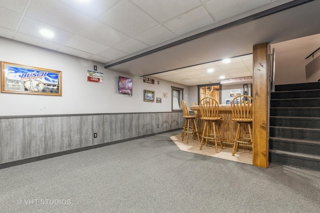 bar with carpet and a drop ceiling