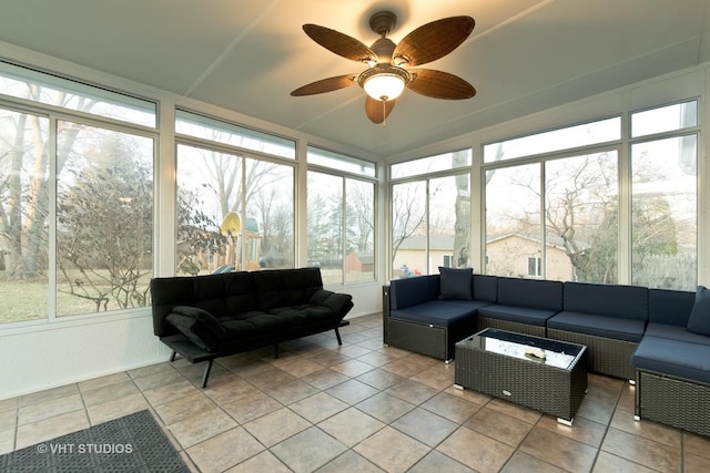 sunroom with ceiling fan and plenty of natural light