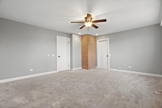 unfurnished bedroom with ceiling fan and light colored carpet