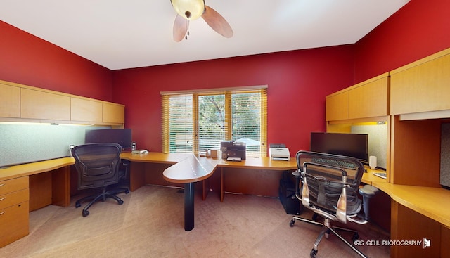 carpeted home office with ceiling fan