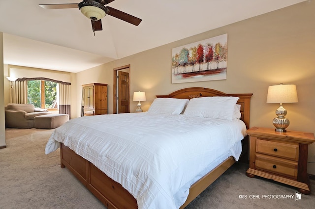 bedroom with lofted ceiling, carpet floors, and ceiling fan