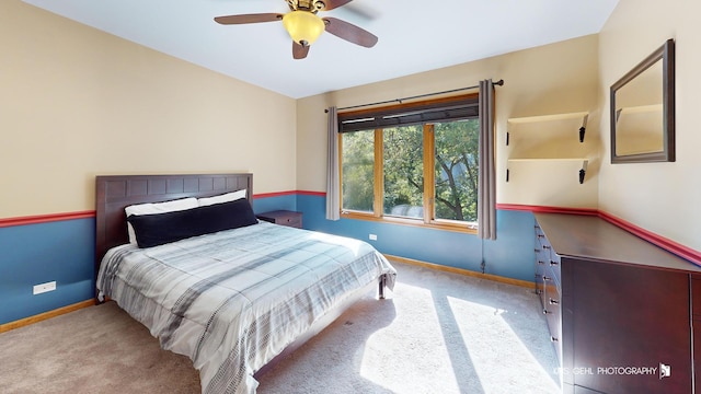 bedroom with ceiling fan and light carpet