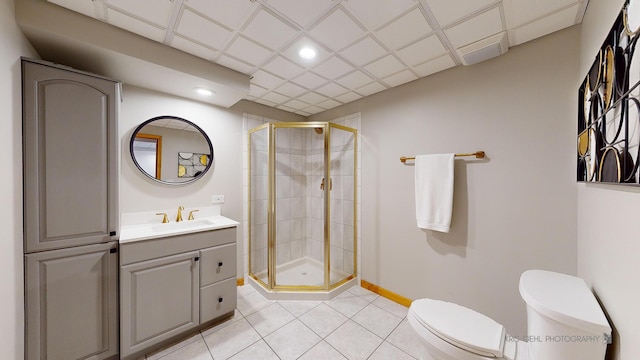 bathroom with toilet, an enclosed shower, tile patterned floors, and vanity