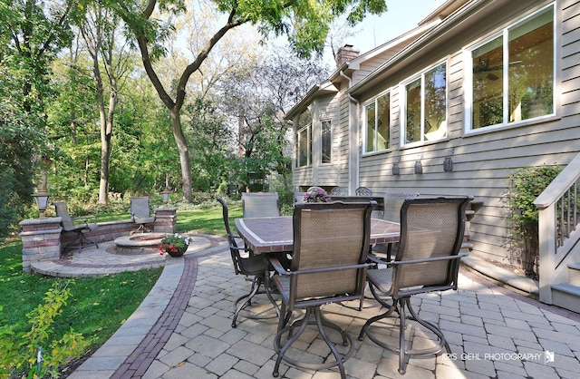 view of patio / terrace featuring a fire pit