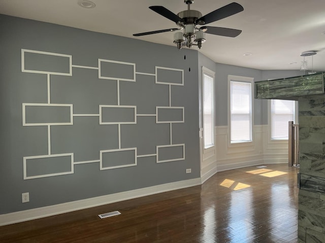 spare room with ceiling fan and hardwood / wood-style floors