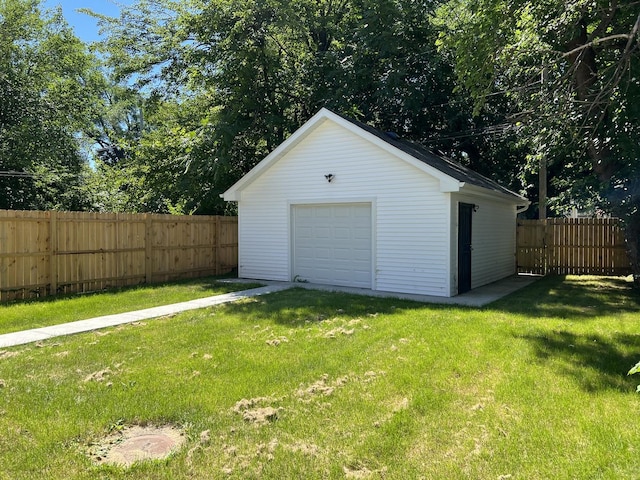 garage with a yard