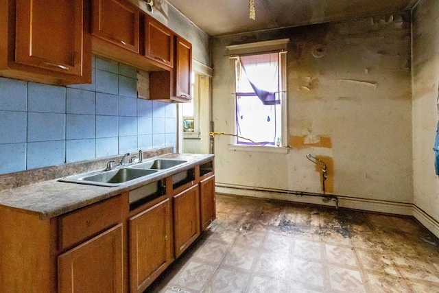 kitchen with decorative backsplash and sink