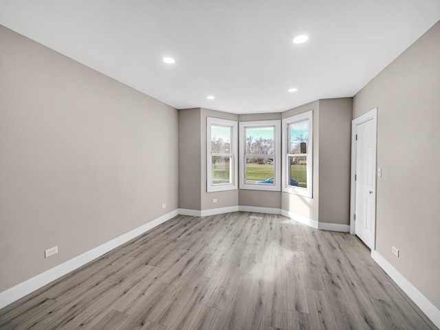 spare room with light hardwood / wood-style floors