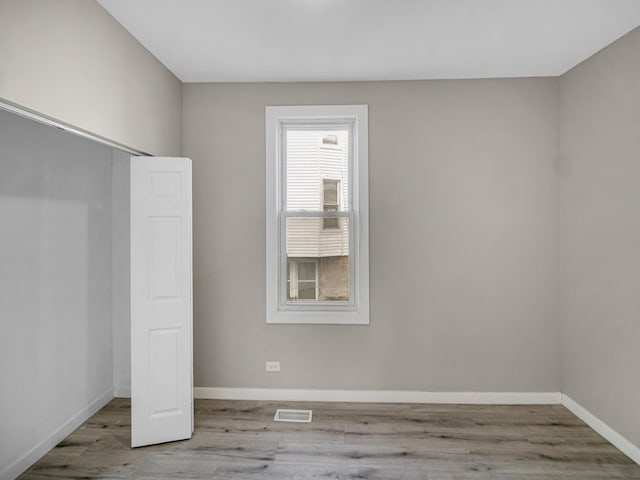 unfurnished bedroom featuring light wood-type flooring