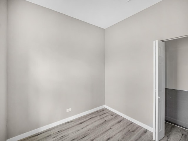 unfurnished room with light wood-type flooring