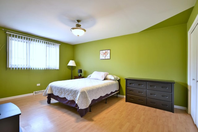 bedroom featuring light wood-type flooring and ceiling fan