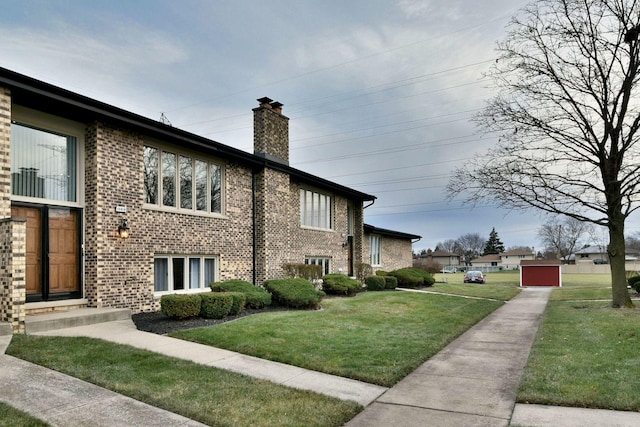 view of side of home featuring a yard