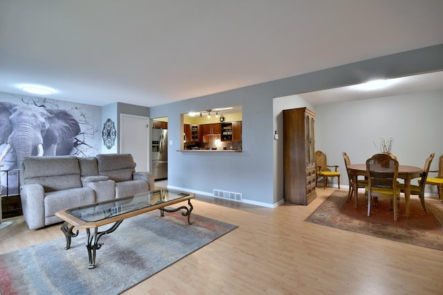 living room with light hardwood / wood-style floors