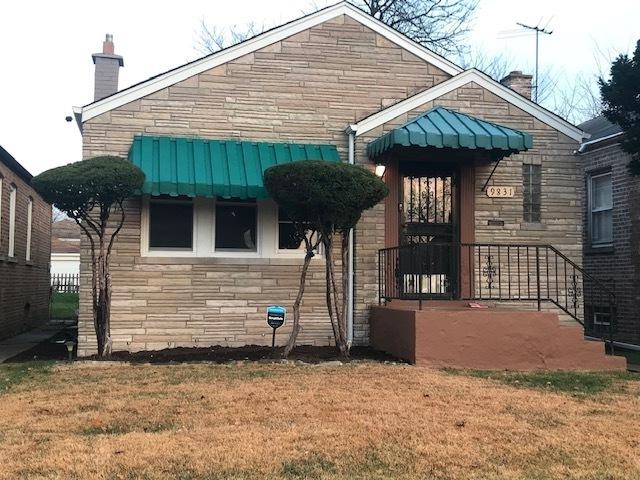 exterior space featuring stone siding, a chimney, and a front yard