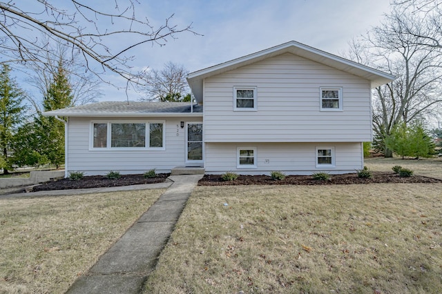 tri-level home featuring a front yard