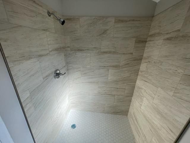 room details featuring a shower stall