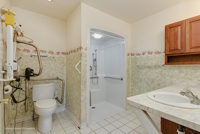 bathroom with tile patterned floors, a shower, vanity, and toilet