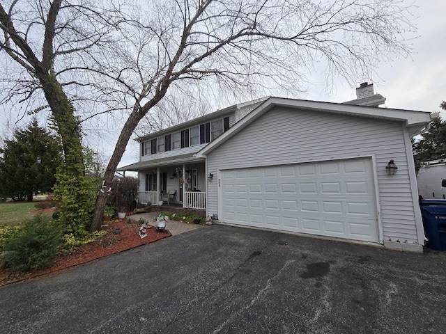 view of front of property featuring a porch and a garage