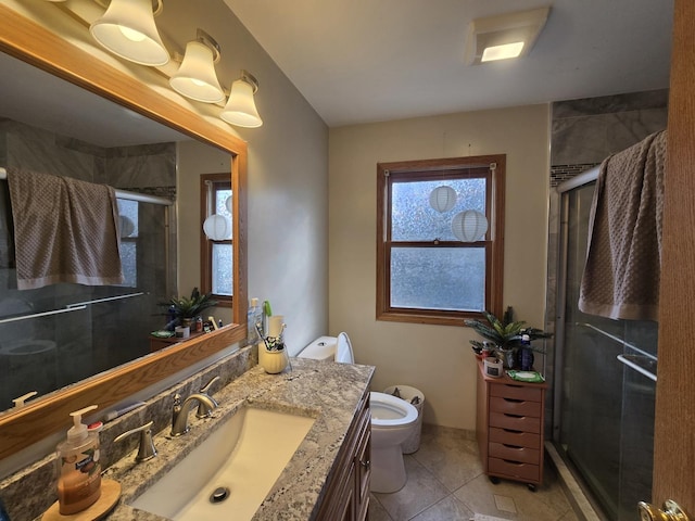 bathroom featuring tile patterned floors, walk in shower, vanity, and toilet