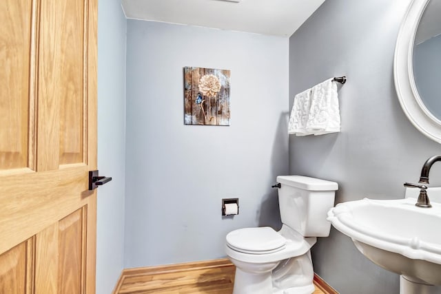 bathroom featuring toilet and sink