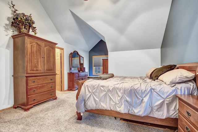 carpeted bedroom featuring vaulted ceiling