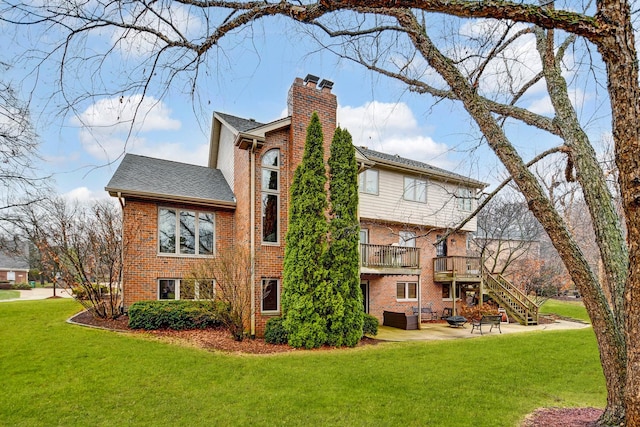 view of property exterior featuring a balcony, a yard, and a patio area