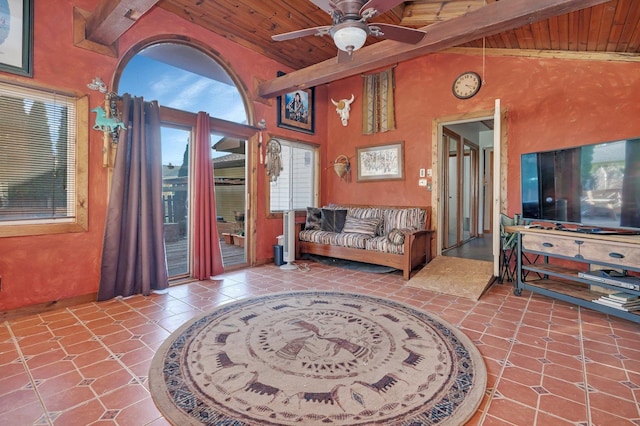 tiled living room with beamed ceiling, plenty of natural light, ceiling fan, and high vaulted ceiling