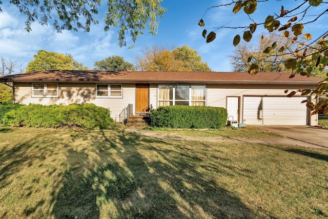 single story home with a garage and a front lawn