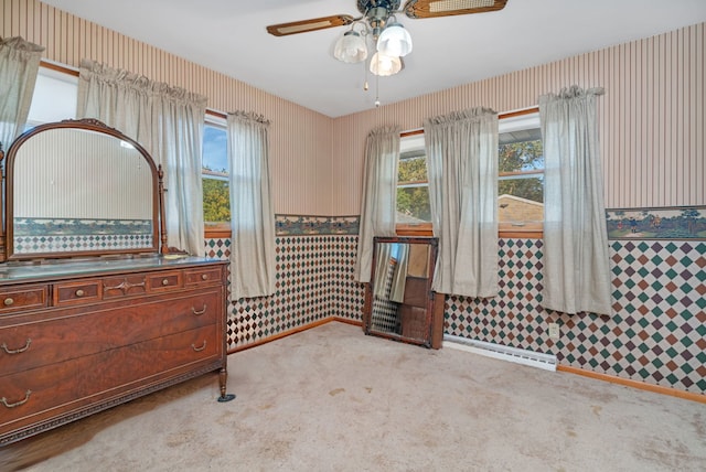 interior space featuring baseboard heating and ceiling fan