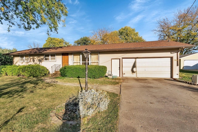 single story home with a front lawn and a garage