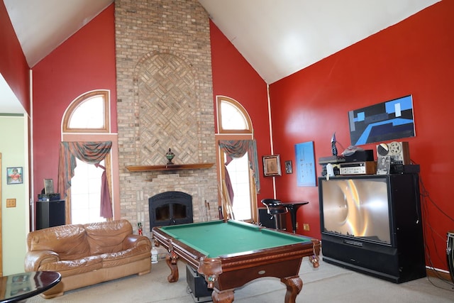 rec room with a fireplace, plenty of natural light, and pool table