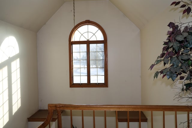 stairway with vaulted ceiling