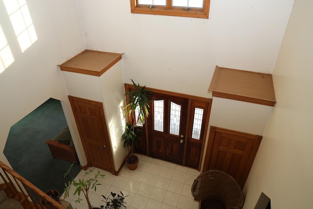 foyer featuring light tile patterned floors