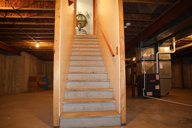 stairs with concrete floors and heating unit