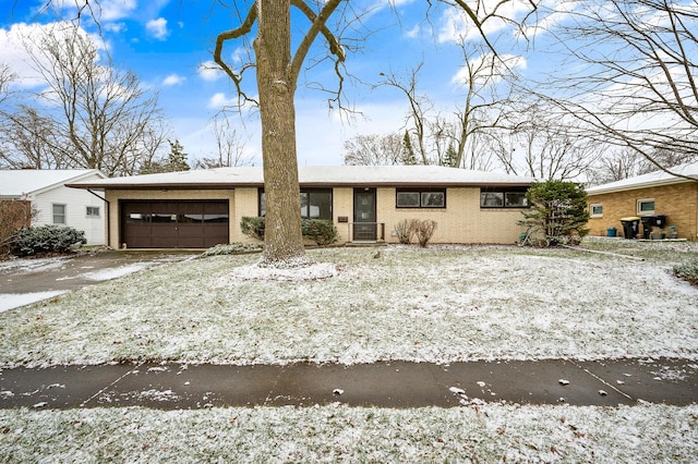 single story home featuring a garage