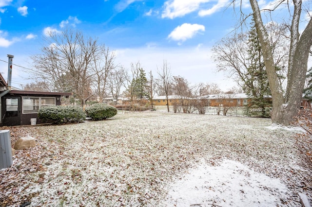 view of yard covered in snow