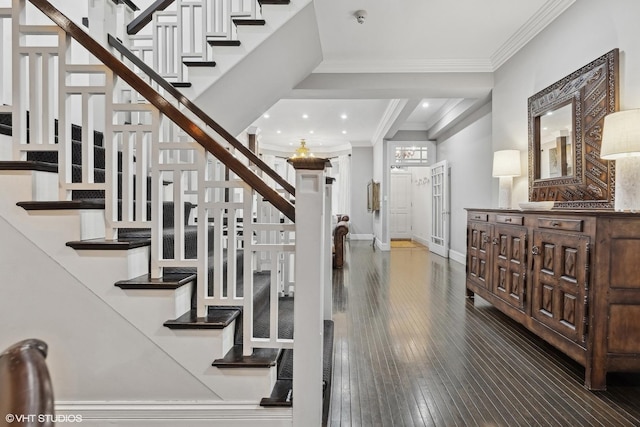 entrance foyer featuring crown molding and wood-type flooring