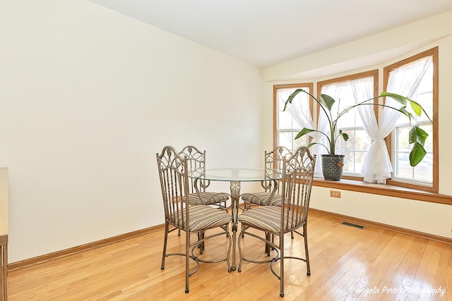 dining room featuring light hardwood / wood-style flooring