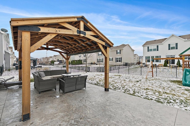 snow covered patio featuring a gazebo