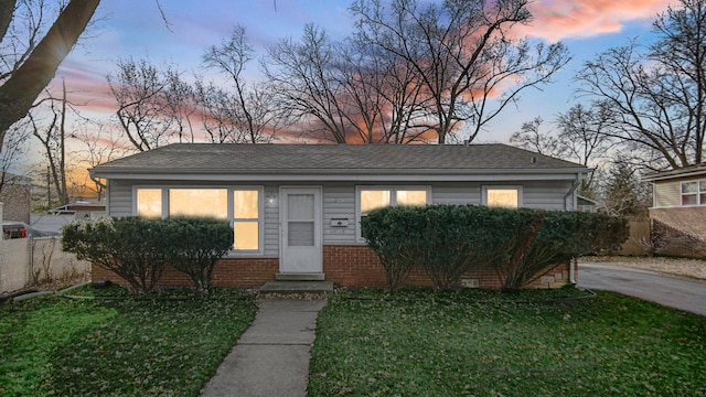 view of front of property with a lawn